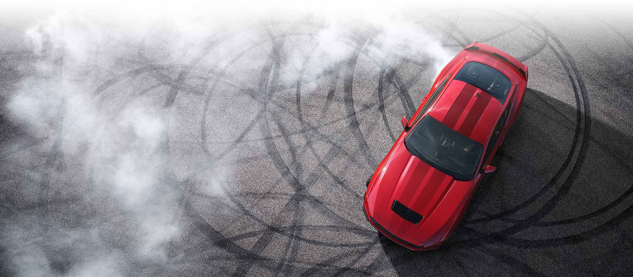Overhead view of a 2024 Ford Mustang® model with tire tracks on pavement | Coughlin Ford of Circleville in Circleville OH